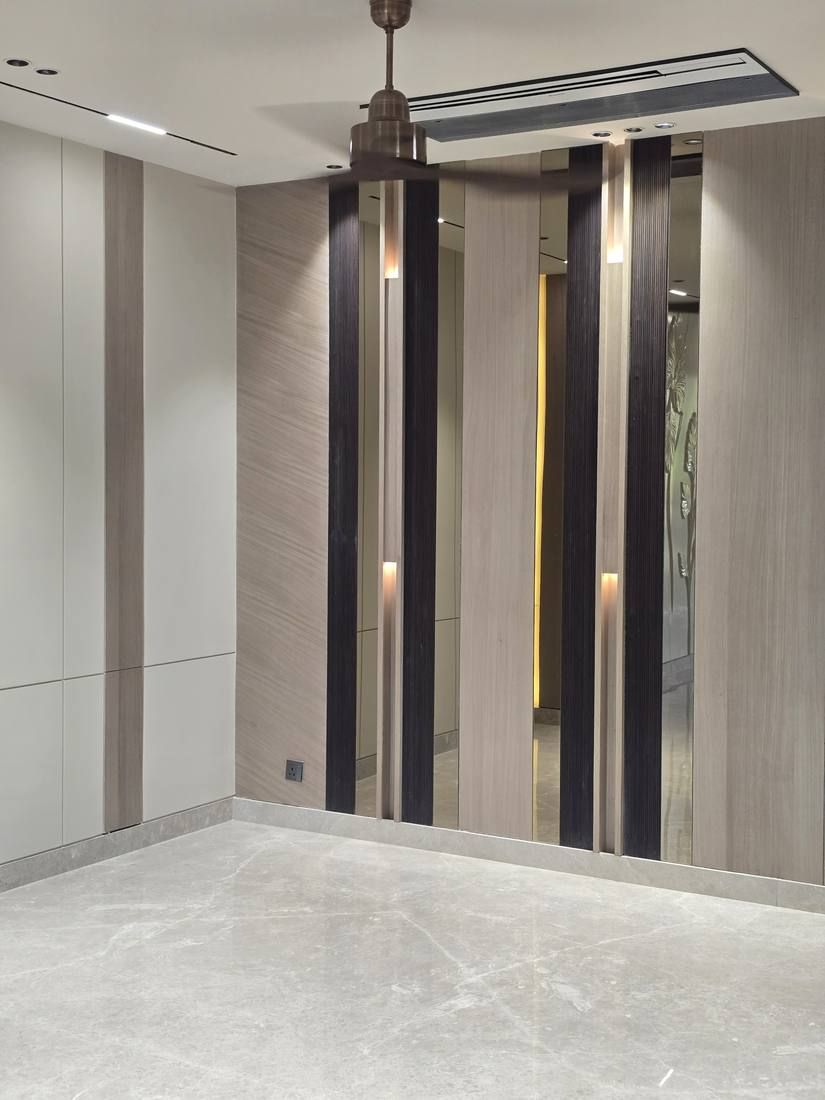 Floor-to-ceiling composition of mirror, veneer and dark panels