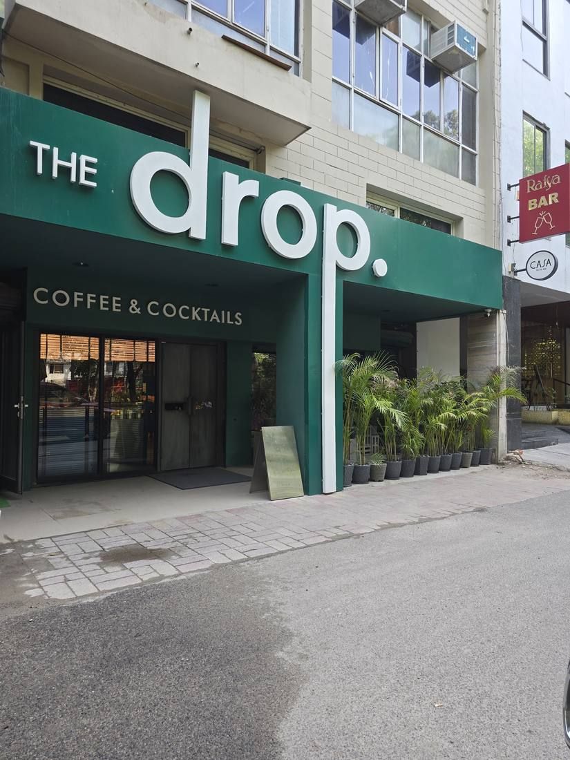 The green shopfront of The Drop in Hauz Khas, signed coffee and cocktails